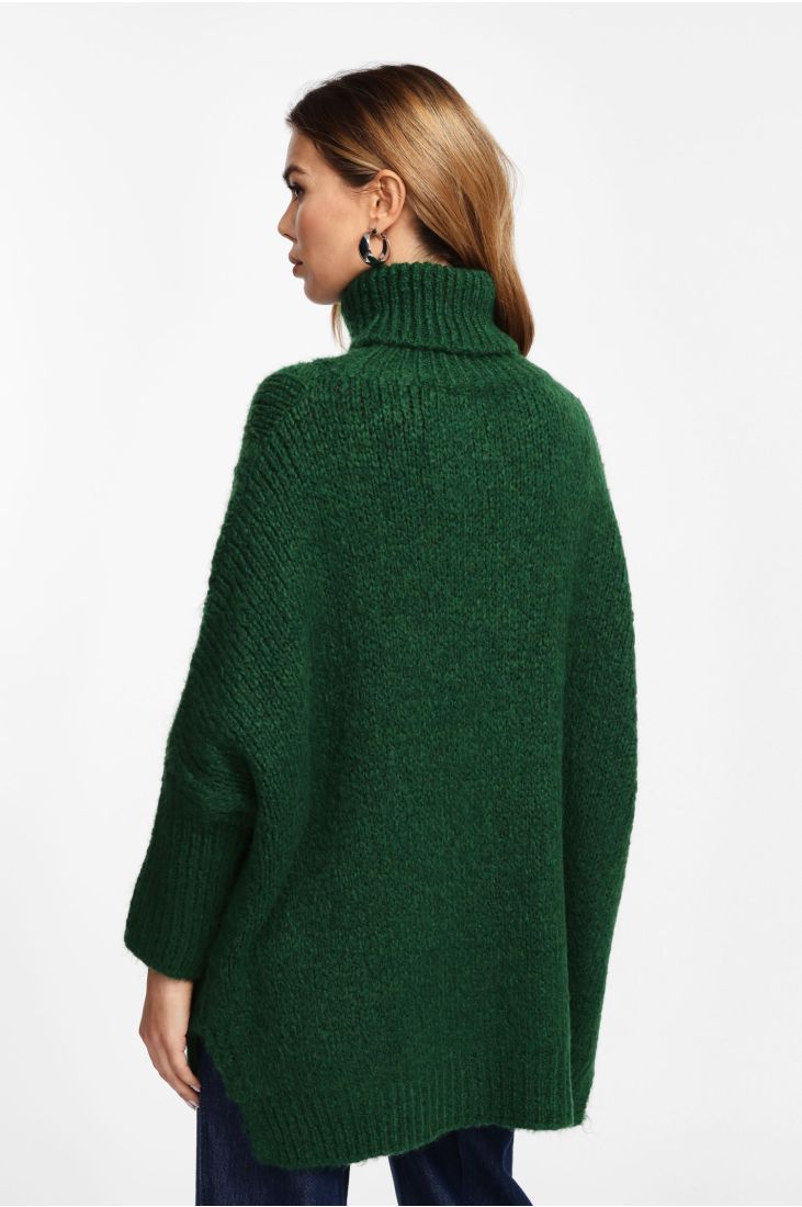 Long turtleneck sweater with cables